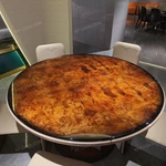 Faceted Pedestal Dining Table with High-Gloss Amber Burl Wood Top